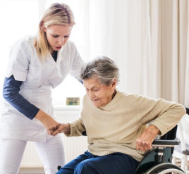 a caregiver woman helping an elderly woman