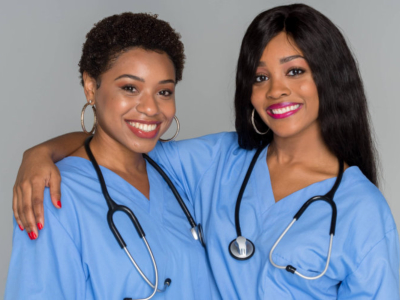 two female nurses smiling