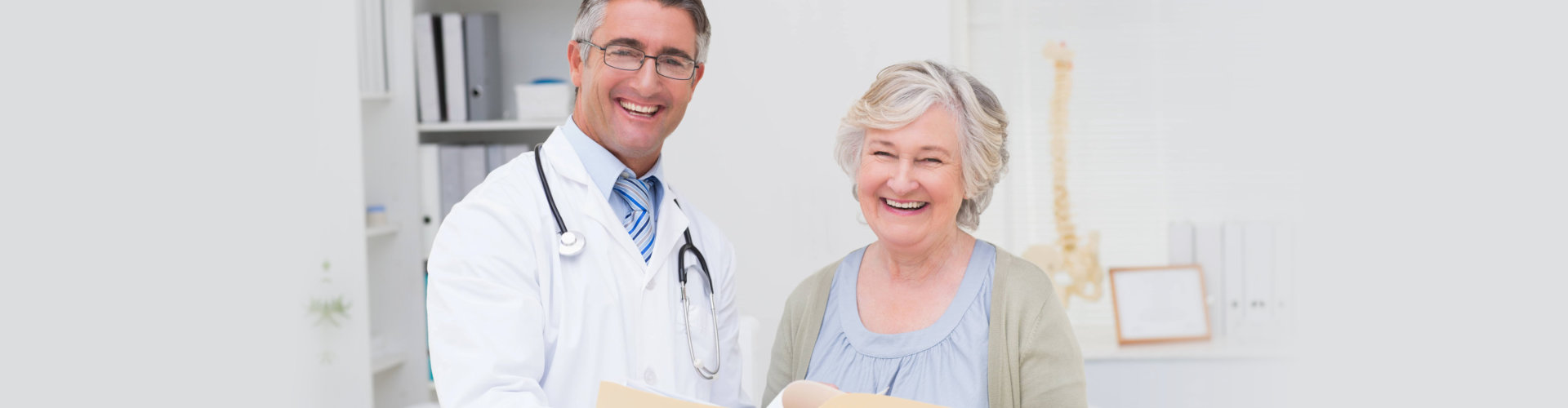 doctor smiling with elderly woman